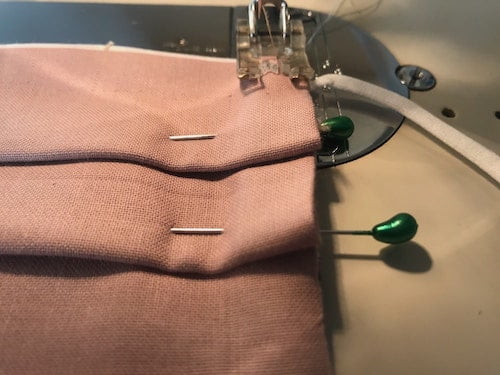 Sew the pleats in place